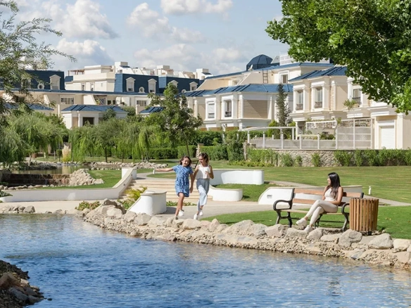 Creekview — Lakeside park with families and townhouses behind